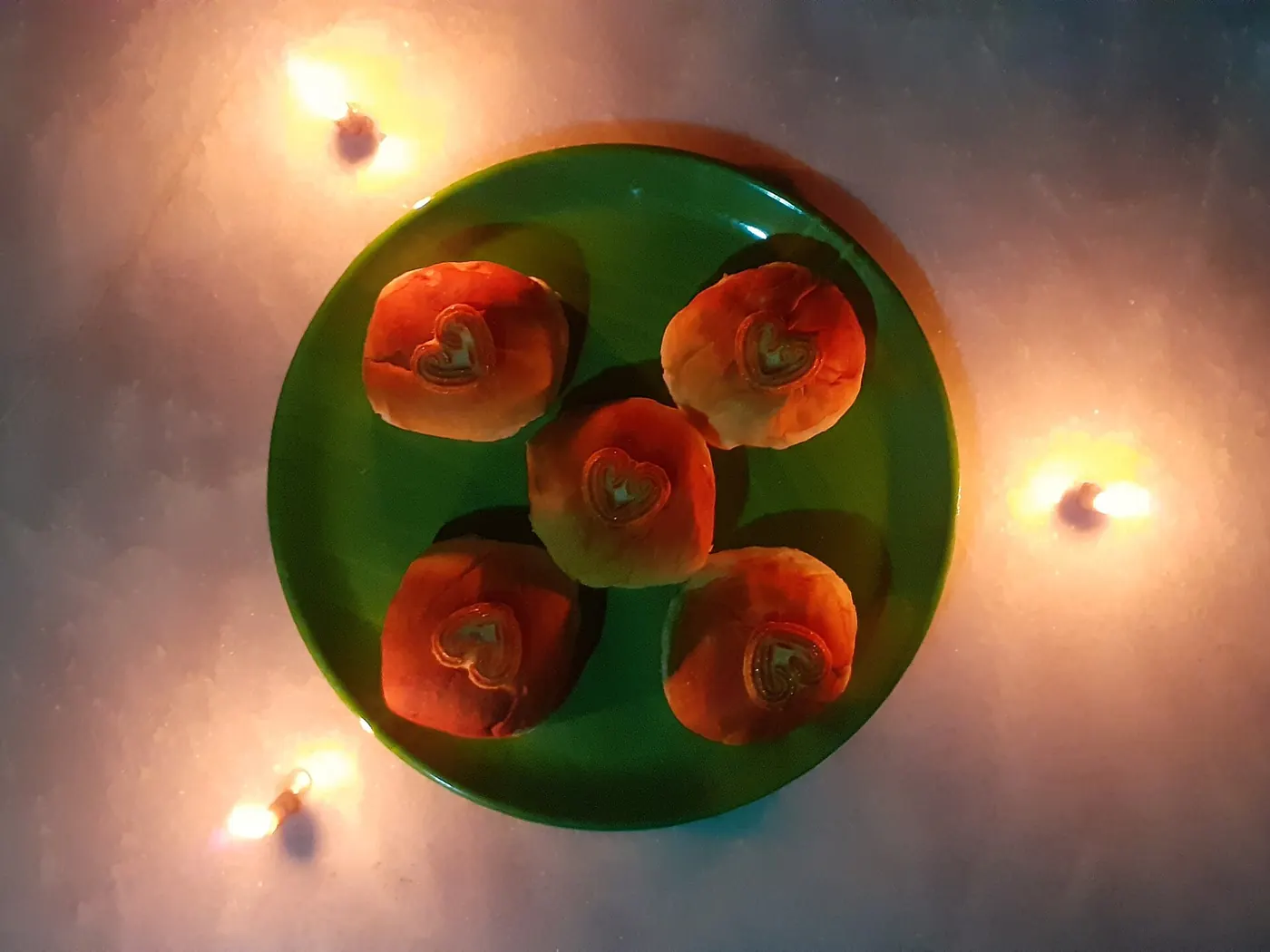 Lit tealight candles in a dark room
