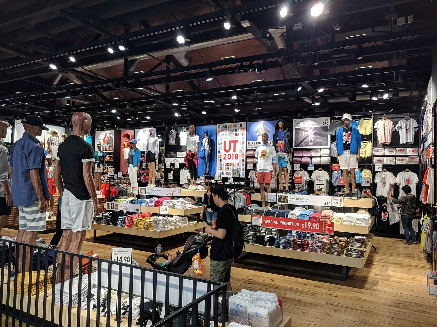 Shoppers browsing a busy clothing store