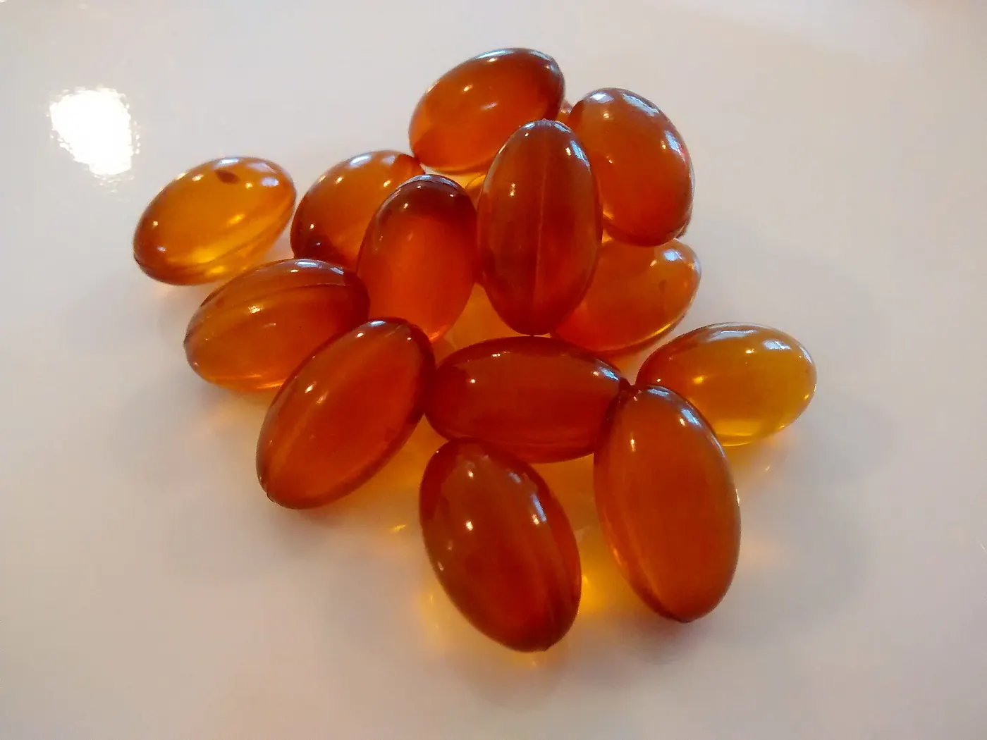 Amber softgel capsules